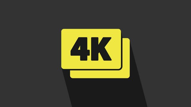 Yellow 4k Ultra HD icon isolated on grey background. 4K Video motion graphic animation