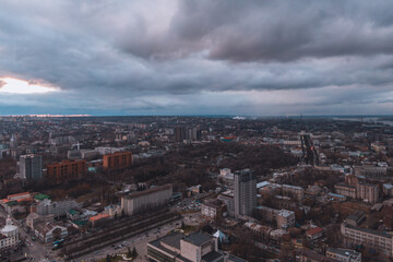 A bird's eye view of the dark blue sky over the city. Gloomy city