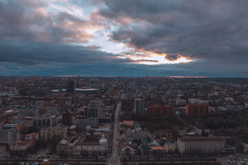 A bird's eye view of the dark blue sky over the city. Gloomy city