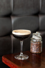 Espresso Martini cocktail drink on table in bar with coffee beans. Great on it's own, for social media or for a poster.