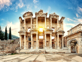 Facade of antique library of Celsus in Ephesus on sunny day - 410312545