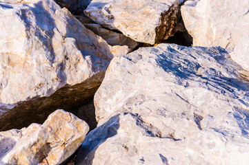 close up detail of rock surface with variety of colors under natural sunlight