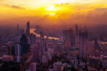 Obraz premium Cityscape sunset aerial view from top building, Aerial view of Bangkok city in Thailand 