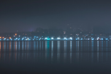 Beautiful panorama of the night city with water.