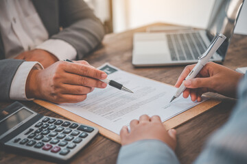 businessman is negotiating, advising, and explaining the matter of the contract to be agreed to...