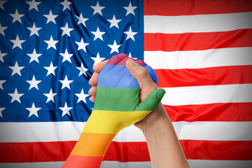 People holding hands against USA flag. LGBT concept