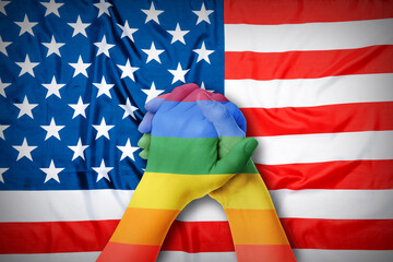 People holding hands against USA flag. LGBT concept