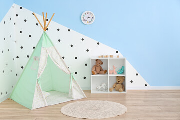 Interior of modern children's room with play tent
