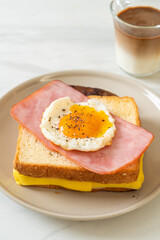 bread toasted cheese topped ham and fried egg with pork sausage