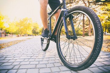 Male cyclist riding bicycle outdoors