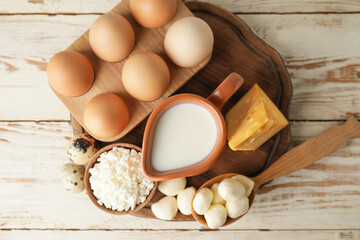 Different dairy products on wooden background