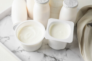 Different dairy products on light background