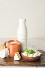 Different dairy products on light background
