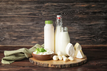 Different dairy products on wooden background