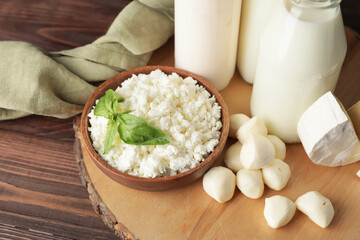 Different dairy products on wooden background