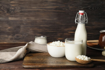 Different dairy products on wooden background