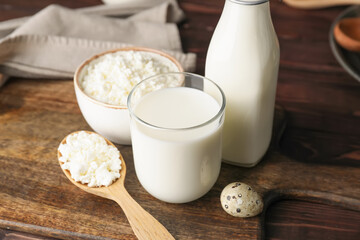 Different dairy products on wooden background