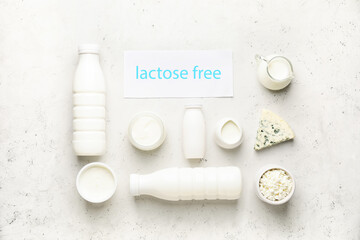 Different dairy products without lactose on light background