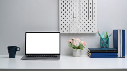 Open laptop computer with blank screen on white table.Blank screen for your text or advertising content.