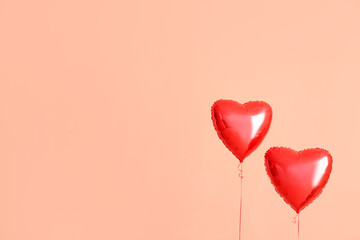 Fototapeta na wymiar Heart shaped air balloons on color background