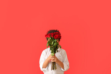 African-American boy with bouquet of beautiful flowers on color background