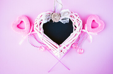 chalk board in shape of  heart for copying space or writing congratulation text, with various red and pink accessories in  shape of  heart, for  postcard or congratulations on Valentines Day