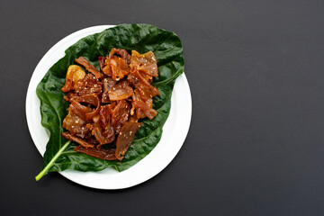 Sweet pork or pork Jerky on dark background.