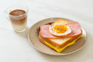 bread toasted cheese topped ham and fried egg with pork sausage