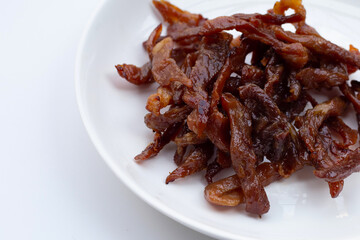 Deep fried sun-dried pork on white background.