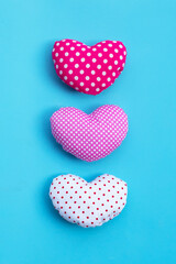 Valentine's hearts on blue background.