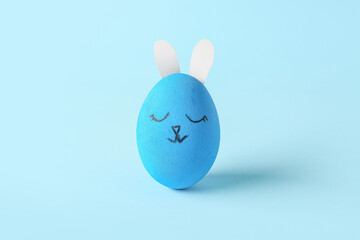 Creative Easter egg on color background