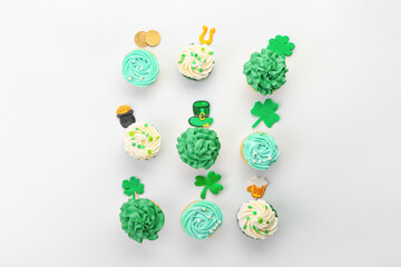 Tasty cupcakes for St. Patrick's Day on white background