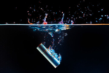 Lipstick case falling into the water with a splash