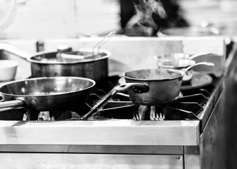 Chef cooking in a kitchen, chef at work, Black and White.