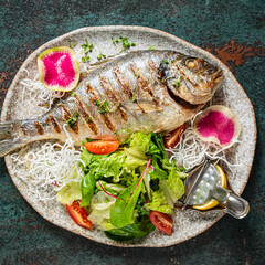 grilled fish with fresh salad