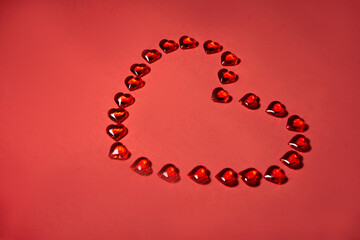 Valentines day hearts background. Many colorful hearts - valentine background. Beautiful decorative heart shaped on red background, valentines day concept