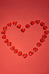 Valentines day hearts background. Many colorful hearts - valentine background. Beautiful decorative heart shaped on red background, valentines day concept