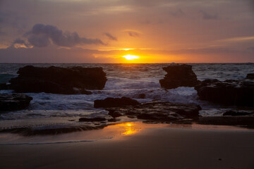 Epic colorful Sunrise over Sandy Beach, a beach on the South Shore of Oahu in Hawaii

