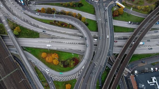 Traffic At Road Junction - Vehicles Driving At E20 And E6 Intersection In Olskroken, Gothenburg, Sweden. - aerial, top down