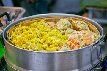 Street food booth selling Chinese specialty Steamed Dumplings in Beijing