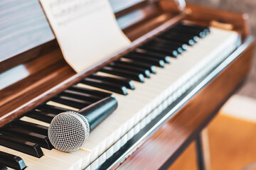microphone on piano keys. music background