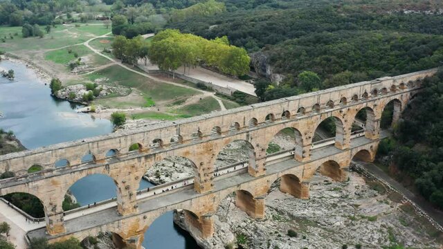 Flight over ancient Pont du Gard aqueduct in France