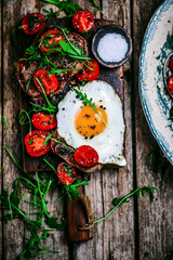 Tuscan steak with fried eggs and cherry tomatoes.selective focus.