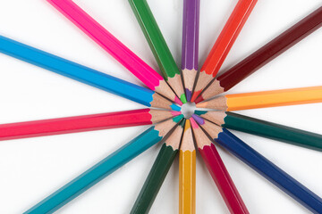 Fototapeta premium Circle made of colorful pencils on white background