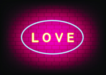 word love yellow neon on pink brick wall