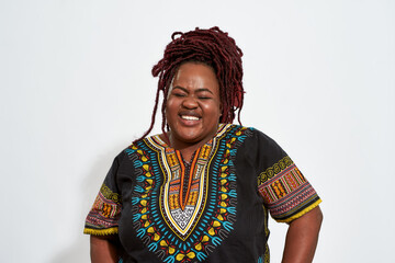 Portrait of happy plump young woman lauging