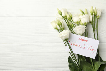 Roses and text Happy Women's Day on white wooden background