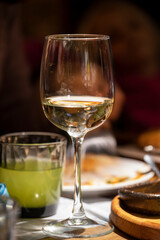 glass with drink and glass with lemonade on festive dark blurred background, vertical