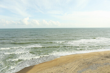 Beautiful sea with waves on sandy beach