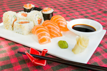 California sushi rolls set on the stone plate, sushi in restaurant, Wasabi and soy sauce